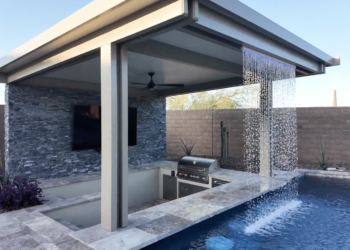 Beautiful backyard pool with a custom waterfall feature