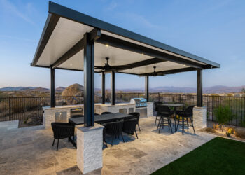 Outdoor kitchen with BBQ, patio cover, and turf